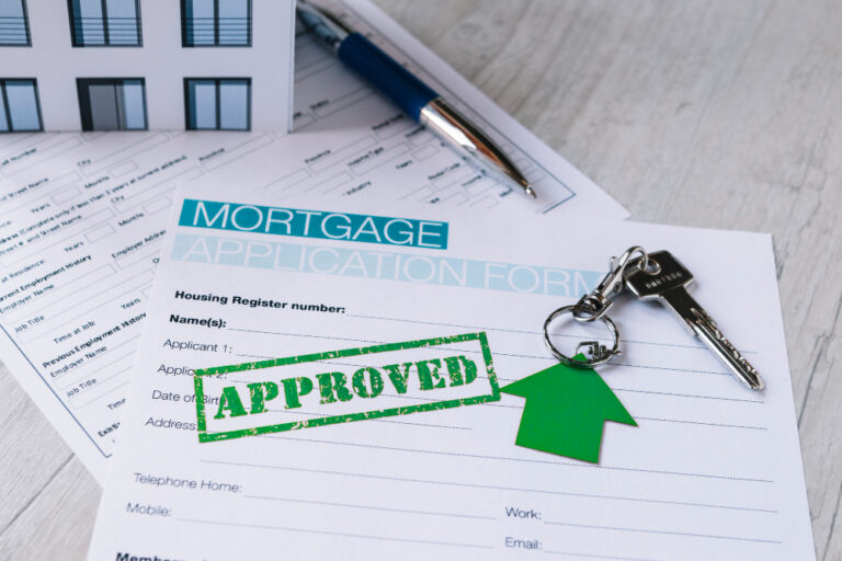 An approved UK property mortgage application form with house keys, ideal for Nigerian citizens investing from abroad.